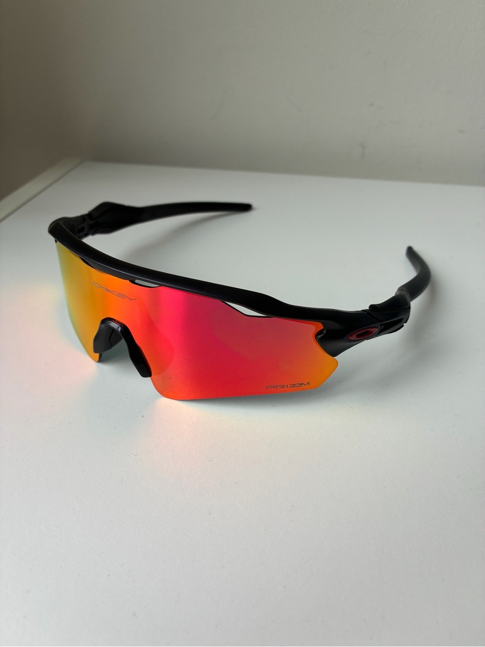 Oakley Black Frame Sunglasses with Red Orange Prizm Lens